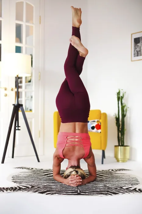 Framed Print : Full body of focused slim female female performing handstand near wall while practicing yoga in light room Framed Print : Full body of focused slim female female performing handstand near wall while practicing yoga in light room