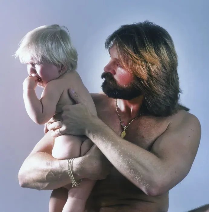 Framed Print : Bodybuilder with daughter. 80s