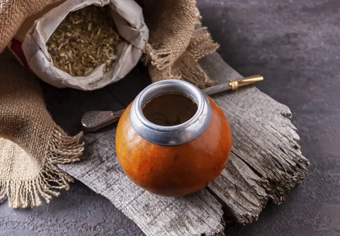 Framed Print : Bombilla with colabash and bag of mate tea on wooden background