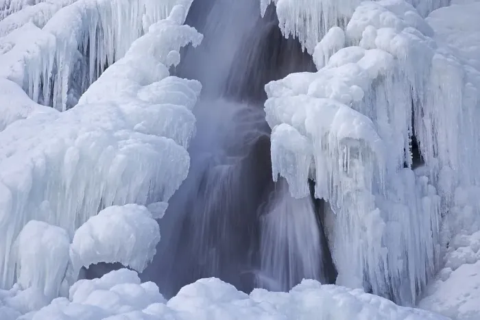 Framed Print : Bora del Nivolet, ice formations and icicles on waterfall of frozen river in winter