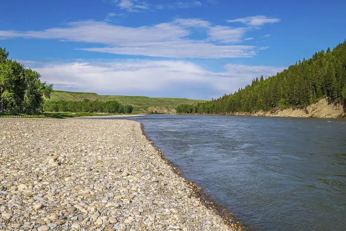 Framed Print : The Bow River flows past the cobble river bank at McKinnon Flats southeast of Calgary
