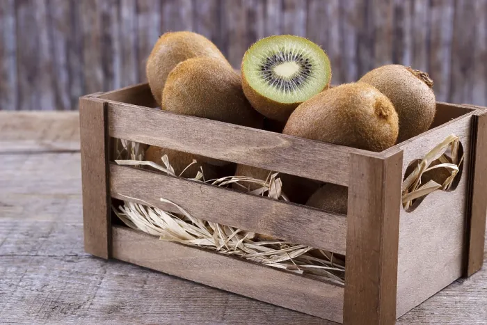 Framed Print : Box of fresh kiwi in on wooden background Framed Print : Box of fresh kiwi in on wooden background