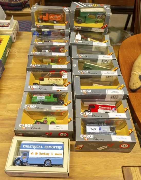 Framed Print : Boxes of Corgi model trucks, vans and other vehicles on display at auction