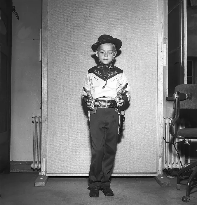 Framed Print : Boy in the 1950s. A boy is dressed in cowboy clothes
