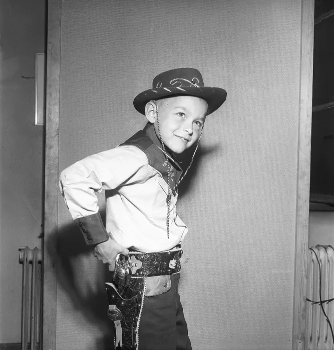Framed Print : Boy in the 1950s. A boy is dressed in cowboy clothes