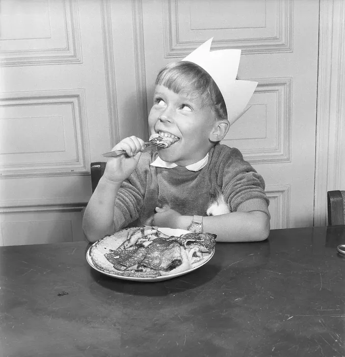 Framed Print : Boy in the 1950s. Smiling when sitting in front of a plate with pancakes and one on the fork Framed Print : Boy in the 1950s. Smiling when sitting in front of a plate with pancakes and one on the fork
