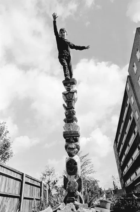 Framed Print : Boy climbs on pole, England, Great Britain