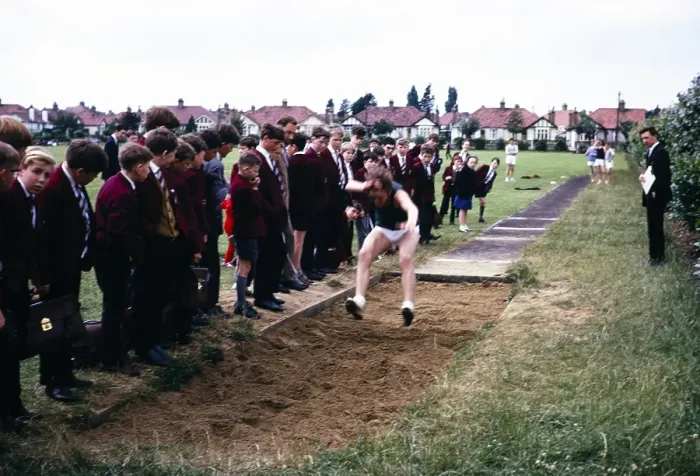 Framed Print : Boy competing in the long jump competition on secondary school sports day, Ilford County High School, Essex, England, 1965 Framed Print : Boy competing in the long jump competition on secondary school sports day, Ilford County High School, Essex, England, 1965