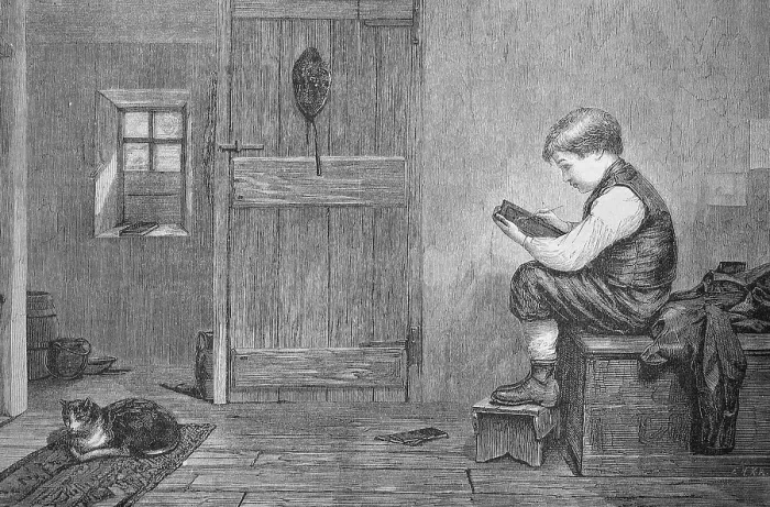 Framed Print : Boy drawing a likeness of his cat on his blackboard