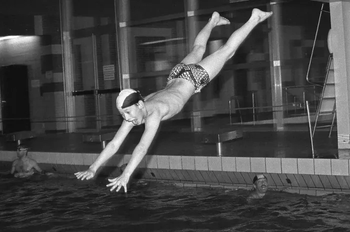 Framed Print : Boy jumps from three-metre board