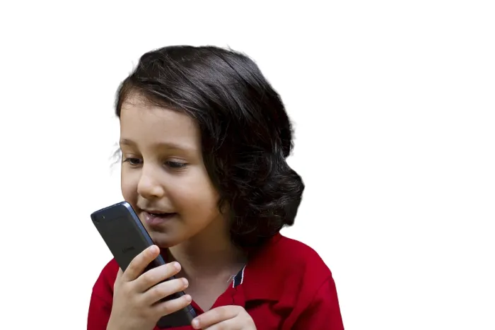 Framed Print : Boy with mobile phone in hand isolated on a white background