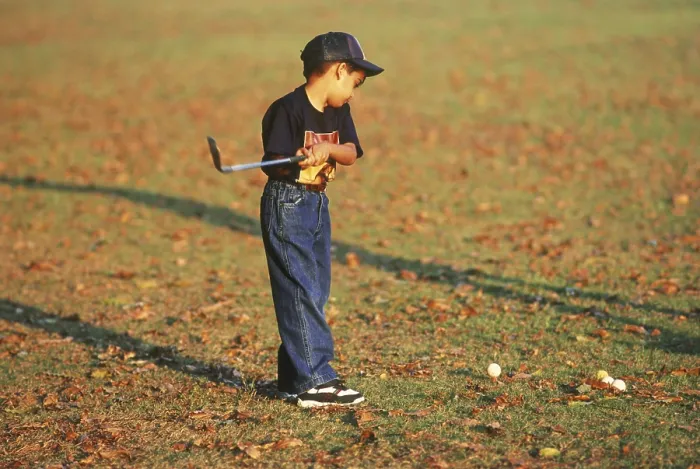 Framed Print : Boy playing golf Framed Print : Boy playing golf