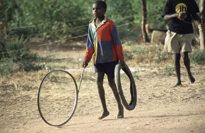 Framed Print : Boy playing with tires, Salima Framed Print : Boy playing with tires, Salima