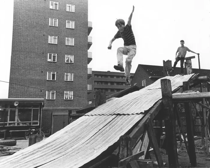 Framed Print : Boy plays on tin slide, England, Great Britain