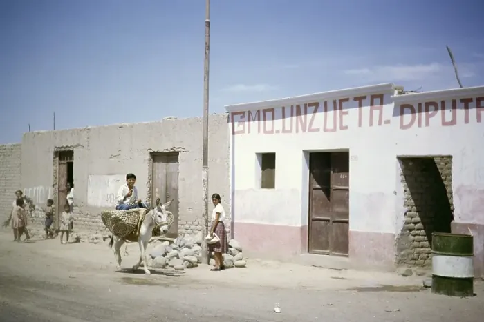 Framed Print : Boy riding a mule, mud-brick house on the street, mud-brick houses in Nazca, Peru, South America, around 1962, South America