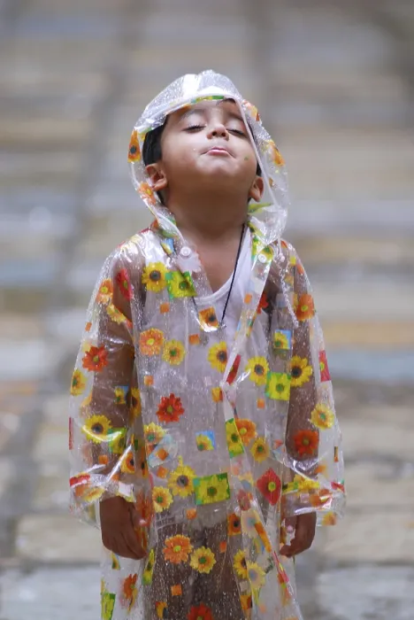 Framed Print : Boy wearing raincoat, India Framed Print : Boy wearing raincoat, India