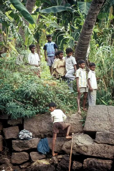 Framed Print : Boys enjoying their holidays standing near a river at Courtalam Kutralam Kuttalam