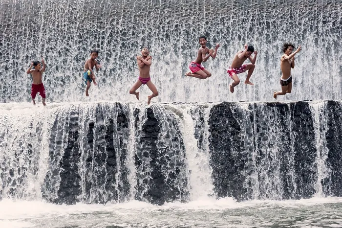 Framed Print : Boys jumping into a waterfall and having fun