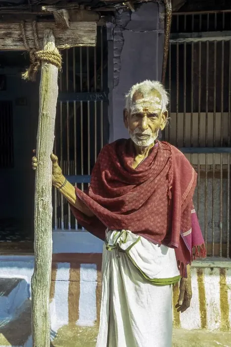 Framed Print : Brahmin old man holding stick in front of his Agraharam house Brahmin quarter at Sundarapandiapuram near Courtalam Framed Print : Brahmin old man holding stick in front of his Agraharam house Brahmin quarter at Sundarapandiapuram near Courtalam