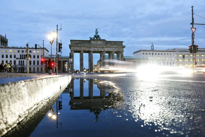 Framed Print : The Brandenburg Tor is reflected in a puddle
