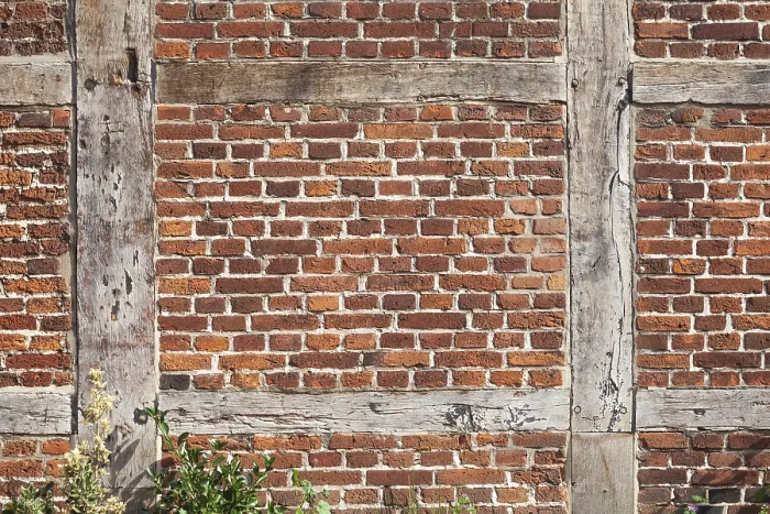 Framed Print : Brick wall and wooden beams on a half-timbered house in the historic centre of Harburg Framed Print : Brick wall and wooden beams on a half-timbered house in the historic centre of Harburg