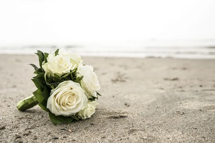 Framed Print : Bridal bouquet of white roses lying on a North Sea beach Framed Print : Bridal bouquet of white roses lying on a North Sea beach
