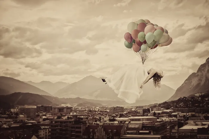 Framed Print : Bride floating on balloons over Innsbruck Framed Print : Bride floating on balloons over Innsbruck