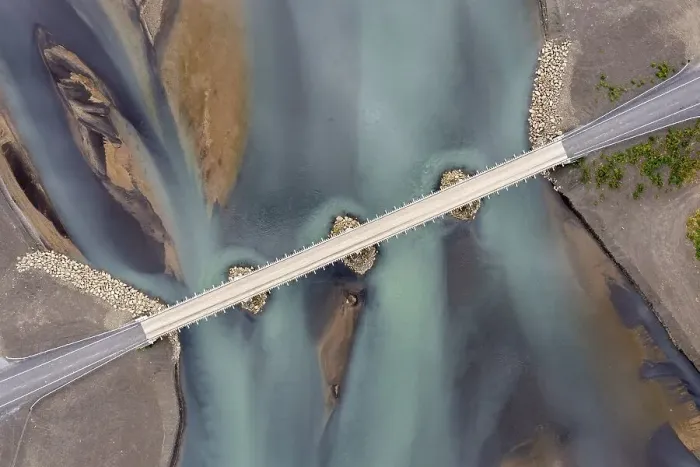 Framed Print : Bridge over glacier river, aerial view Framed Print : Bridge over glacier river, aerial view