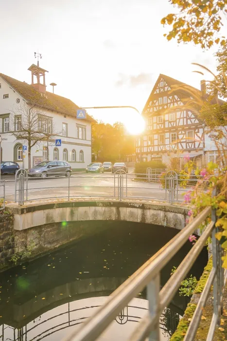 Framed Print : Bridge over a river, half-timbered buildings at sunset Framed Print : Bridge over a river, half-timbered buildings at sunset