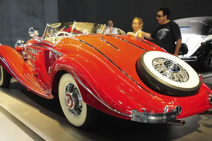 Framed Print : A bright red convertible vintage car at an exhibition