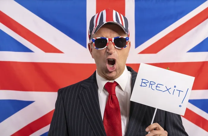Framed Print : British male businessman with Brexit banner and UK flag Framed Print : British male businessman with Brexit banner and UK flag