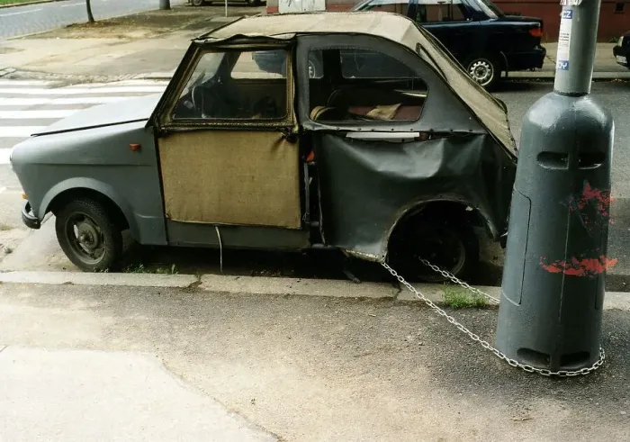 Framed Print : Broken car chained to a lamppost ca
