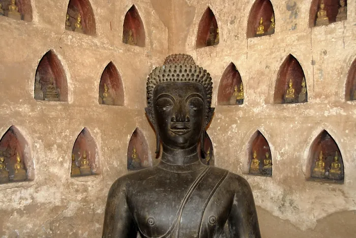 Framed Print : Bronze Buddha statue in a corner Framed Print : Bronze Buddha statue in a corner