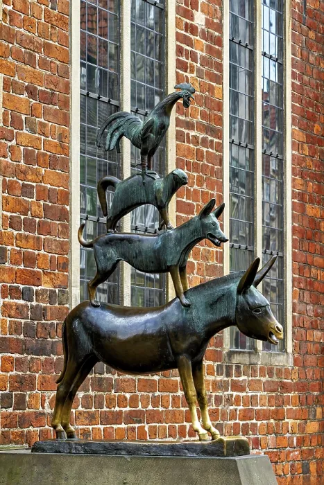 Framed Print : Bronze sculpture of the Bremen Town Musicians in front of a historic brick wall Framed Print : Bronze sculpture of the Bremen Town Musicians in front of a historic brick wall
