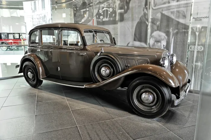 Framed Print : Brown classic car in an exhibition with historic ambiance