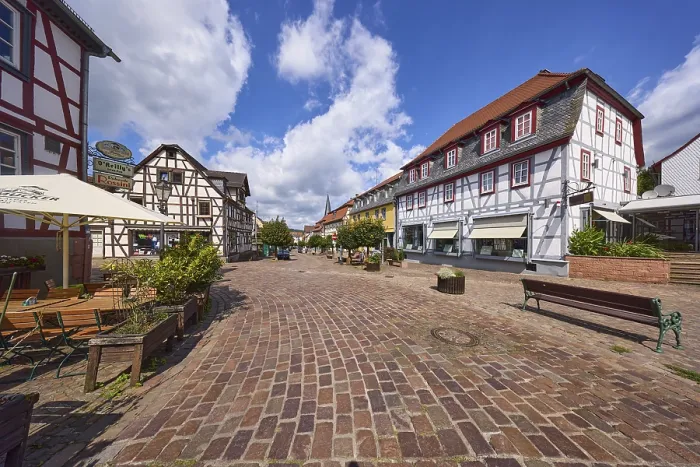 Framed Print : Brown street with half-timbered houses