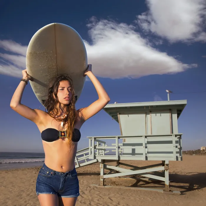 Framed Print : Brunette surfer teen girl holding surfboard in Santa Monica beach California Framed Print : Brunette surfer teen girl holding surfboard in Santa Monica beach California