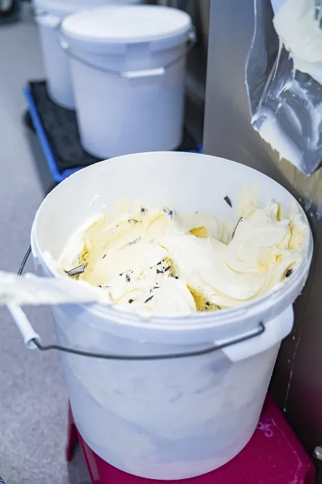 Framed Print : A full bucket of vanilla ice cream with chocolate chips from the production