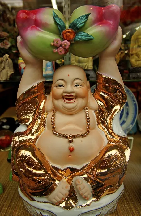Framed Print : Buddah figure in a shop window