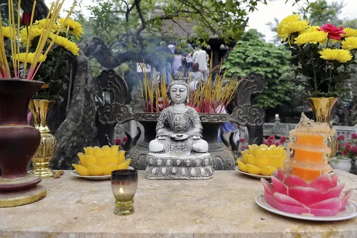 Framed Print : Buddha altar in front of the One Pillar Pagoda