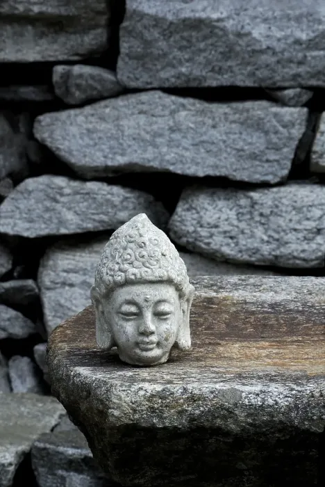 Framed Print : Buddha head on stone slab
