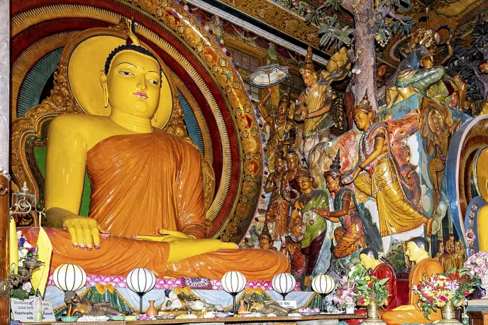 Framed Print : Buddha statue on an altar surrounded by frescoes and religious figures in a spiritual and colorful scene