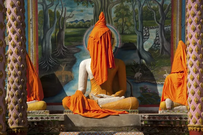 Framed Print : Buddha statue covered with orange fabrics