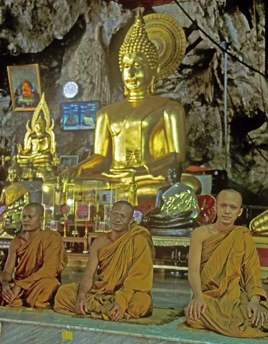 Framed Print : Buddha statue, monks praying, Wat Tam Sua monastery near Krabi