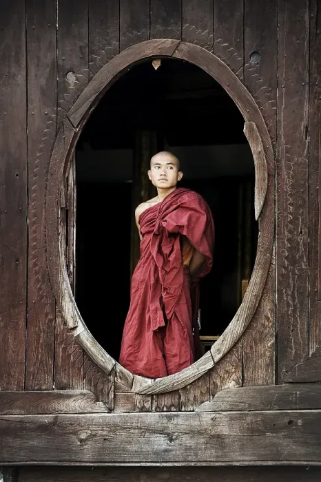 Framed Print : Buddhist monk standing at a window Framed Print : Buddhist monk standing at a window