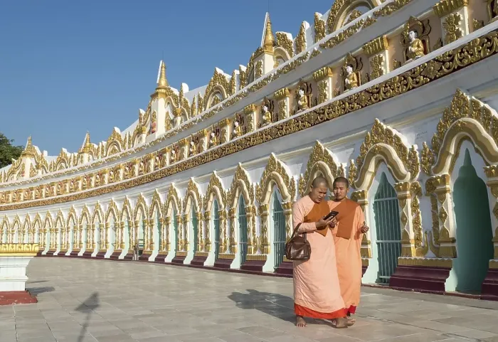 Framed Print : Buddhist monks in front of the curved chamber of Umin Thounzeh