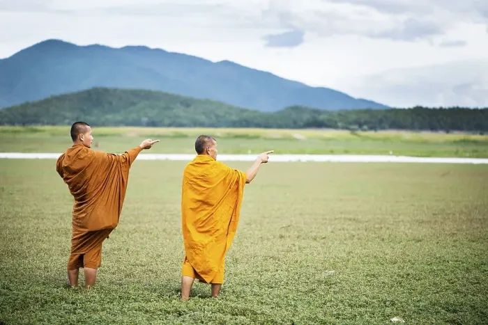 Framed Print : Two Buddhist monks in the dry lake bed at Doi Tao