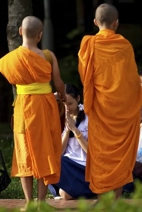 Framed Print : Buddhist monks in the early morning tradition of gathering alms in Chiang Mai