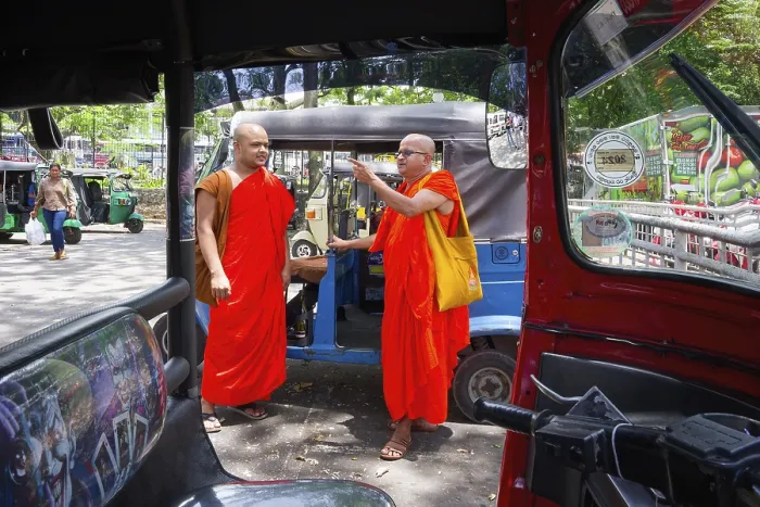 Framed Print : Buddhist monks talking near a tuk-tuk