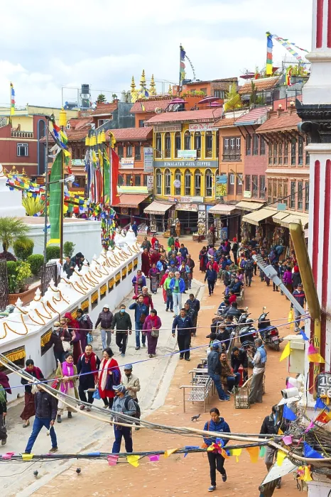 Framed Print : Buddhist pilgrims making the kora or ritual circumnavigation around the Boudhanath Stupa